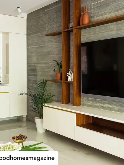 The media unit in 'Calm Abode', as featured in Good Homes. We designed this piece with a mix of white laminate and wood, set against a grey stone wall, to create a look that is both modern and textured.
