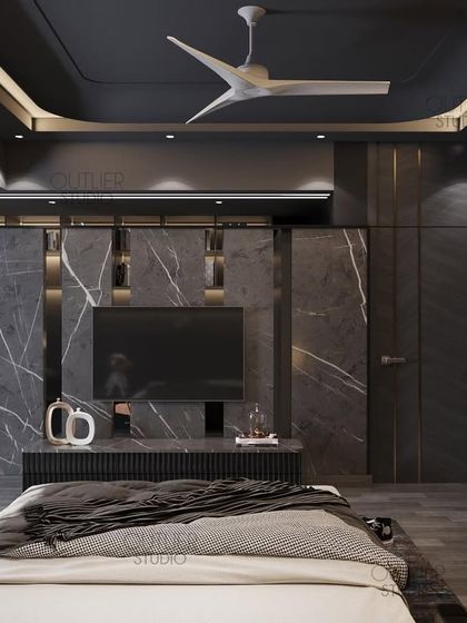 Which TV series are you looking forward to watching this year? This dark and dramatic bedroom features a full-wall media unit made of black marble, with an integrated walk-in closet visible to the side.
