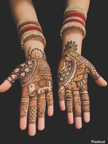 This design showcases two of my favorite traditional motifs: the royal elephant and the graceful peacock. The hands feature different but complementary patterns, a popular choice for guests at weddings.