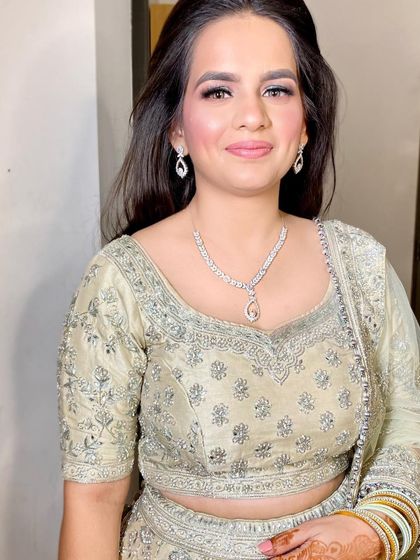 A close-up of the sweetest bride-to-be, Deepti, for her sagan. We kept the makeup clean and luminous, with a soft pink lip and simple eye makeup.