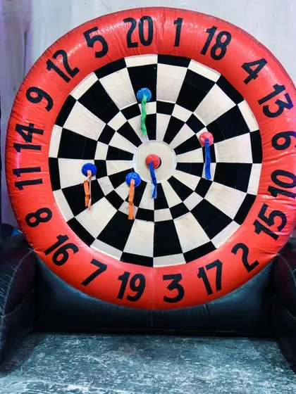 A giant inflatable dartboard game that uses velcro darts, making it a safe and fun accuracy challenge for all ages.