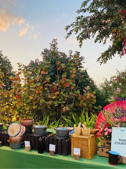 We create immersive culinary experiences like this dedicated Thai Counter. The setup is decorated with thematic elements like traditional fans and bamboo steamers, transporting guests with authentic flavors and ambiance.