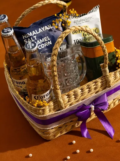 A curated beer basket for the enthusiast. We include your choice of beer, a classic beer mug, and a selection of savoury snacks like cashews, popcorn, and garlic toast.