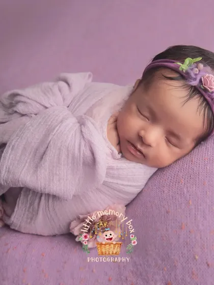 I love exploring different shades, like this lovely heliotrope purple. A simple side-lying pose on a matching blanket is perfect for showing off your baby's profile.