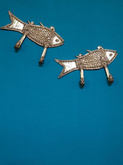 These fish-shaped wall hooks are an example of the unique, handcrafted metalwork featured throughout the hotel. These small details contribute to the property's distinct character and charm.