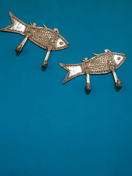 These fish-shaped wall hooks are an example of the unique, handcrafted metalwork featured throughout the hotel. These small details contribute to the property's distinct character and charm.