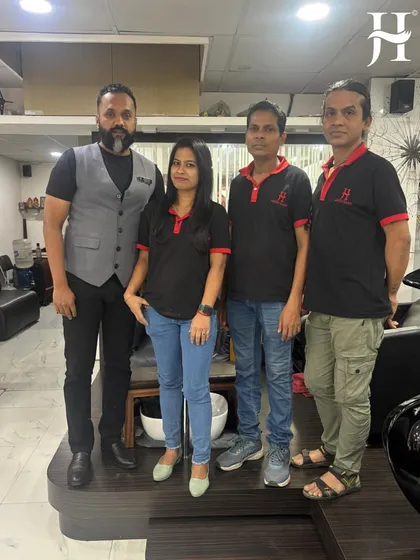 Our National Technical Head with the team at one of our Kolkata salons. We invest in personalized training to ensure consistent quality across all our locations.