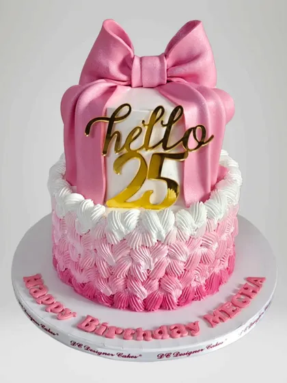 A close-up of the 25th birthday cake, showing the basket-weave piping and a large fondant bow. The "Hello 25" topper adds a trendy touch.