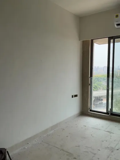 The beginning of a transformation. This "before" shot shows an empty room with unfinished walls, a blank slate that we reimagined into a warm and inviting part of a 1200-square-foot traditional home.