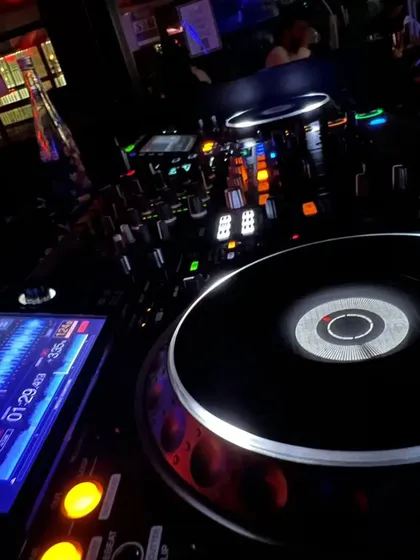 A close-up of my DJ console during a Bollywood night. You can see the track waveform on the screen as I prepare the next song to keep the dance floor moving.