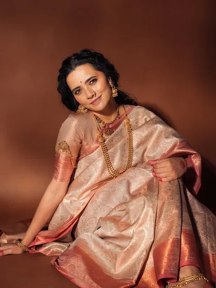 This pose captures the soft, glowing makeup and the gentle expression of the model, creating a serene and elegant portrait.