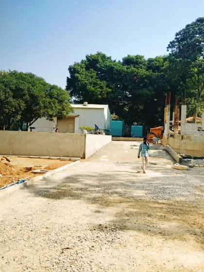 A view of the site with kerbstones laid, defining the edges of future roads and pathways.