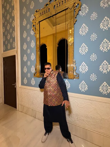 A cool pose against a beautifully designed wall. The aesthetic of the venue often inspires my own energy and style for the event.