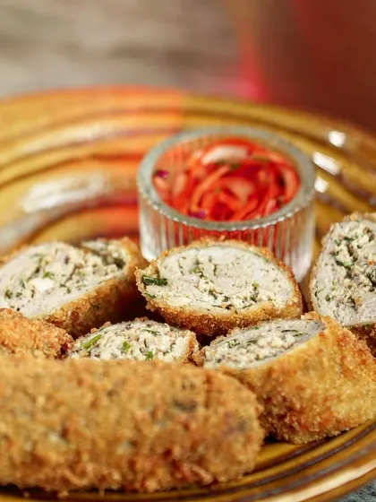 A close-up of the crispy, breaded exterior of my Chicken Swiss Rolls. Each roll is fried to a perfect golden brown, ensuring a satisfying crunch in every bite.