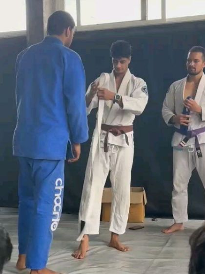Posing with my coaches and senior belts. Learning from experienced practitioners is the key to growth in Brazilian Jiu-Jitsu.