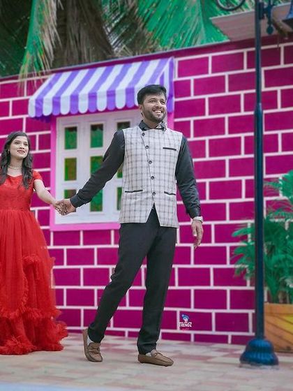 Having fun with colorful and quirky backdrops. This studio set is perfect for couples who want a playful and vibrant pre-wedding shoot.