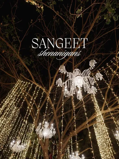 'Sangeet Shenanigans' under a tree dripping with crystal chandeliers and fairy lights. This shows how we can transform any part of a venue into a magical space.