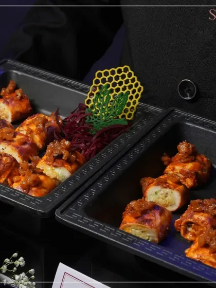 Artfully presented paneer rolls, showcasing a modern take on a classic Indian appetizer. The honeycomb crisp adds a unique textural element.