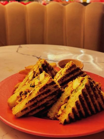 Another example of a mindful cheat meal: a grilled sandwich enjoyed at a cafe.