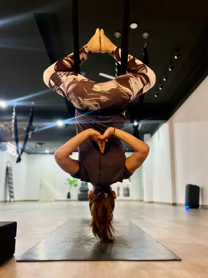 Finding tranquility in an inverted Baddha Konasana (Bound Angle Pose). This pose opens the hips and groin while offering the calming benefits of being upside down.