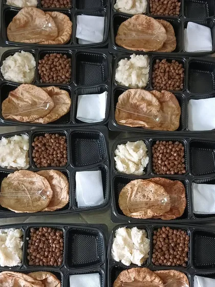 Prasad prepared for Ram Navami. This includes Sooji Halwa, Kale Chane, and Pooris, packed and ready for distribution.