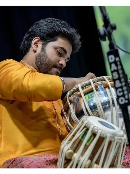 Tuning the tabla before a performance at the Malhar Festival. This is a crucial ritual to ensure the perfect sound.