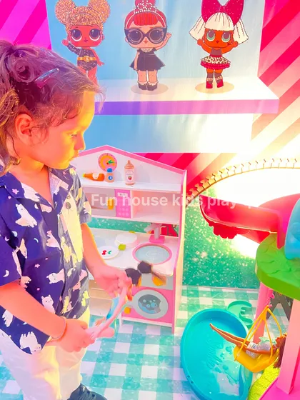 A child playing with the pretend kitchen set, showing how our rentals create immersive play experiences.