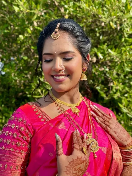 A candid, joyful moment. The makeup is set to be long-lasting and picture-perfect, capturing her glow throughout the day.