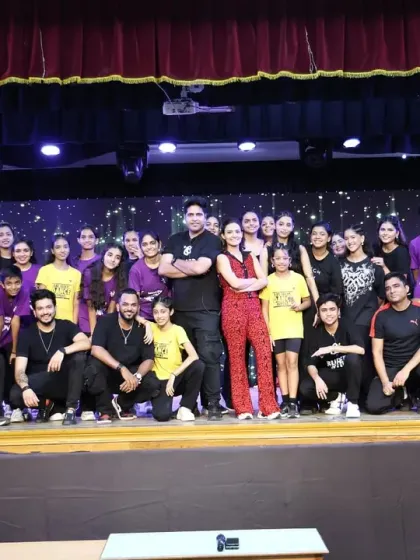 The entire team of instructors and choreographers with our students. We are a close-knit family dedicated to the art of dance.