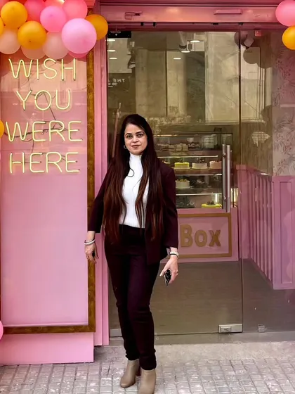 Welcome to Pink Box. We started this journey to create a place that feels special but also warm and familiar. I hope when you see our pink door and the "Wish You Were Here" sign, you feel invited to come in and make a sweet memory.