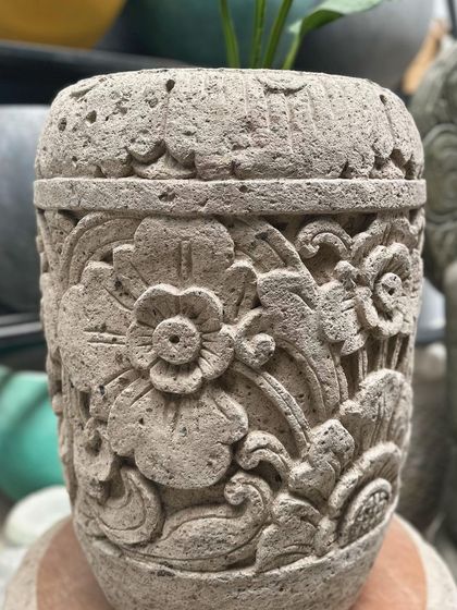 The 'Madu' planter is perfect for smaller spaces. Standing at 25 inches tall, it brings intricate stone carving to compact gardens or homes.