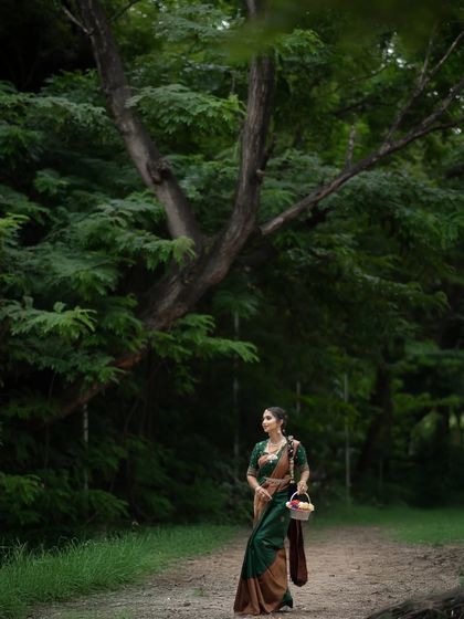 This emerald green and brown Kancheevaram silk saree is a sophisticated and earthy choice for any special occasion.