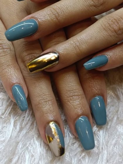 A sophisticated and modern design combining a muted teal polish with gold chrome accent nails. The mix of matte color and high-shine metallic creates a beautiful contrast.