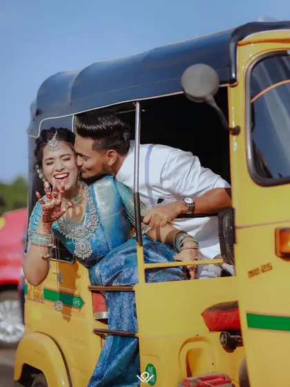 Fun, spontaneous moments are just as important as the formal ones. This playful shot of a couple in an auto-rickshaw captures the joyful spirit of their wedding day in Bangalore.