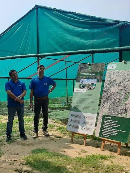 Our team explains the layout and purpose of our restoration sites to the Valvoline Cummins volunteers, using maps and informational displays.