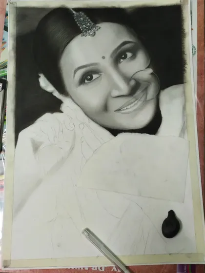 A work in progress shot of the bride portrait. Her face and hair are complete, showcasing the realistic shading, while her traditional clothing is still a light outline.