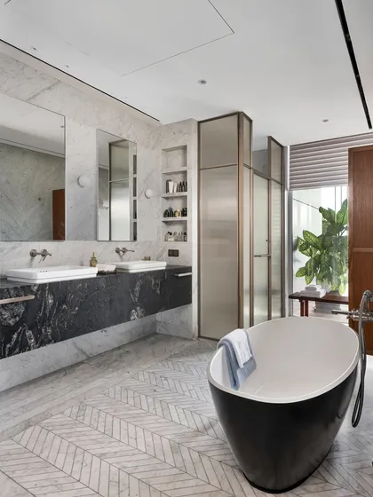 The master bathroom of the Worli Duplex showcases our approach to timeless luxury through a palette of black and white marble. We used a combination of white Carrara and Bianco Nero marble, with detailed mosaic flooring, to create a space that is both classic and contemporary.
