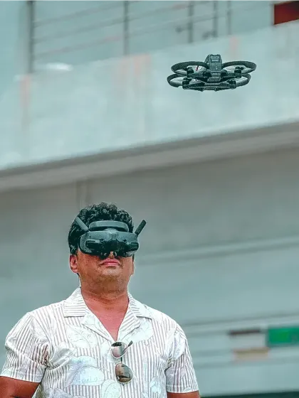 Here I am, piloting my FPV drone with goggles for a first-person view. This shows the advanced, DGCA-certified technology I use to get those immersive, dynamic fly-through shots that make my videos stand out.