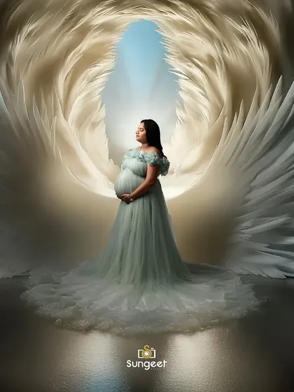 An ethereal portrait featuring our angel wings prop and a delicate light blue gown. This setup creates a heavenly and serene image, celebrating the miracle of new life.
