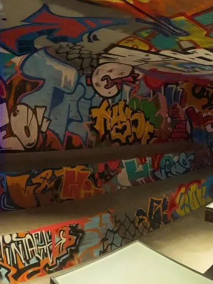 We take this art worldwide. This was a 'Graff Overload' project in Dubai, covering an entire space from floor to ceiling. When a client wants full immersion, we deliver.