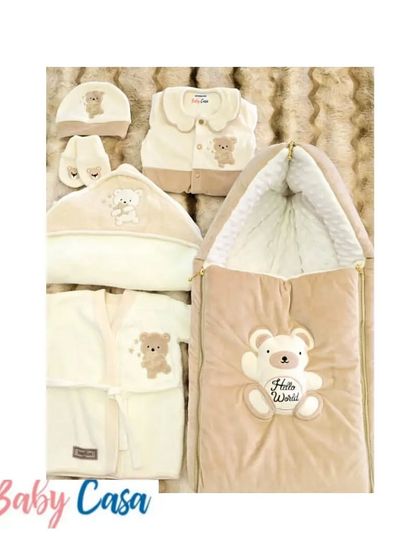 A complete teddy bear themed trousseau for a newborn. This set includes a "Hello World" sleeping bag, a hooded towel, a vest, and two different romper styles for ultimate comfort and cuteness.