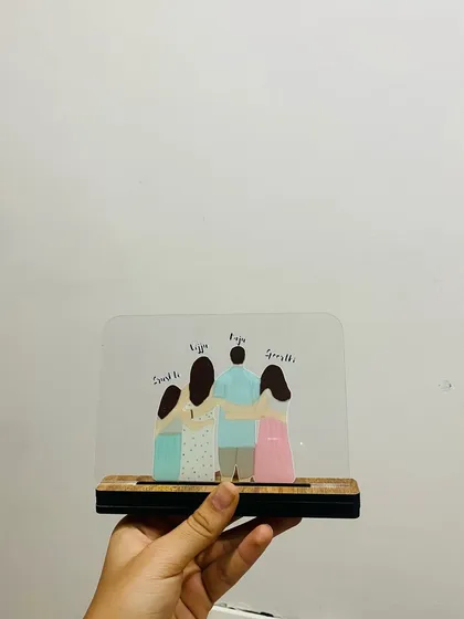 A clear, front-facing shot of the family acrylic standee. You can see the clean lines of the illustration and the personalized names above each person, making it a truly one of a kind family portrait.