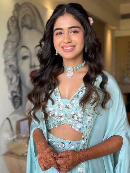 Another shot of Serena's Haldi look, this time with a fun pop-art background that matches her vibrant personality.