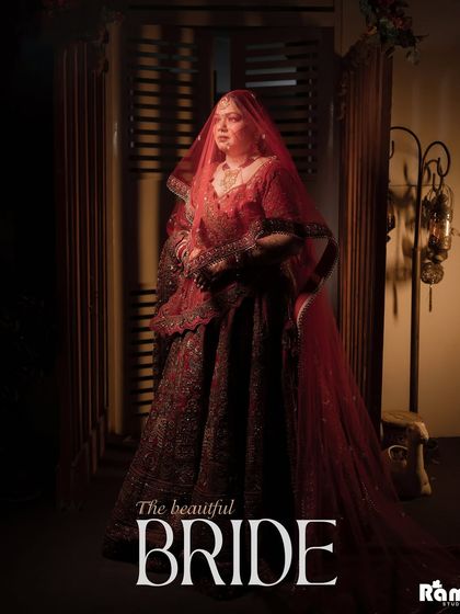 A classic and elegant portrait titled "The beautiful BRIDE." The soft lighting and the bride's regal pose under her red veil create a timeless and sophisticated image that highlights her grace.