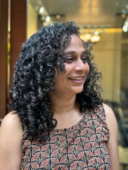 These smiles mean the world to me. I've been caring for this client's curls for two years, and it's been a joy to see her embrace her beautiful hair.