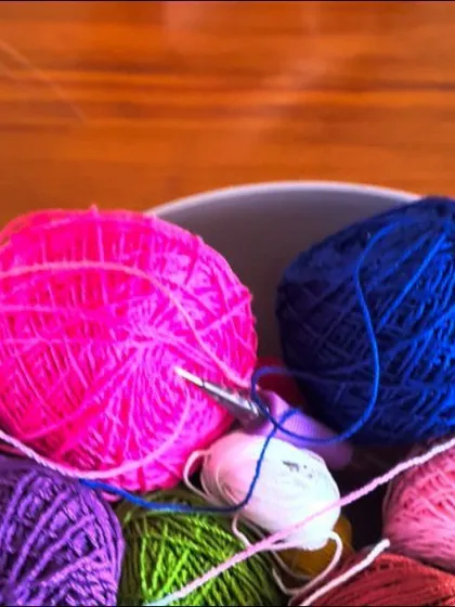 A bowl of vibrant yarn, ready to be turned into a beautiful creation. Choosing the colors is one of the most exciting parts of the process.
