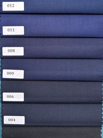 An array of blues, from deep navy to a brighter royal blue. Blue is a cornerstone of men's tailoring, and we offer a shade for every preference and occasion.