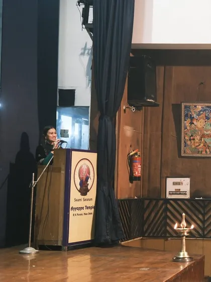 Addressing the audience at the Ayyappa Swamy Temple performance. It is always a pleasure to introduce my students and share the context of the pieces they present.