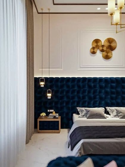 A luxury master bedroom concept designed by our team. It features a full-wall tufted velvet headboard, elegant pendant lights, and wall mouldings to create a rich and sophisticated ambiance.