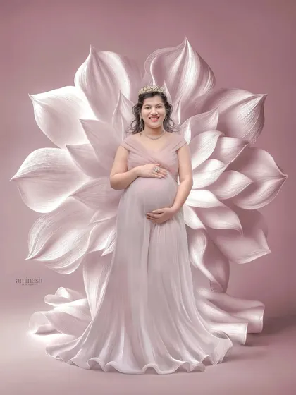 For a touch of surreal beauty, I use props like this giant oversized flower. It creates a stunning, artistic backdrop for a truly memorable maternity portrait.